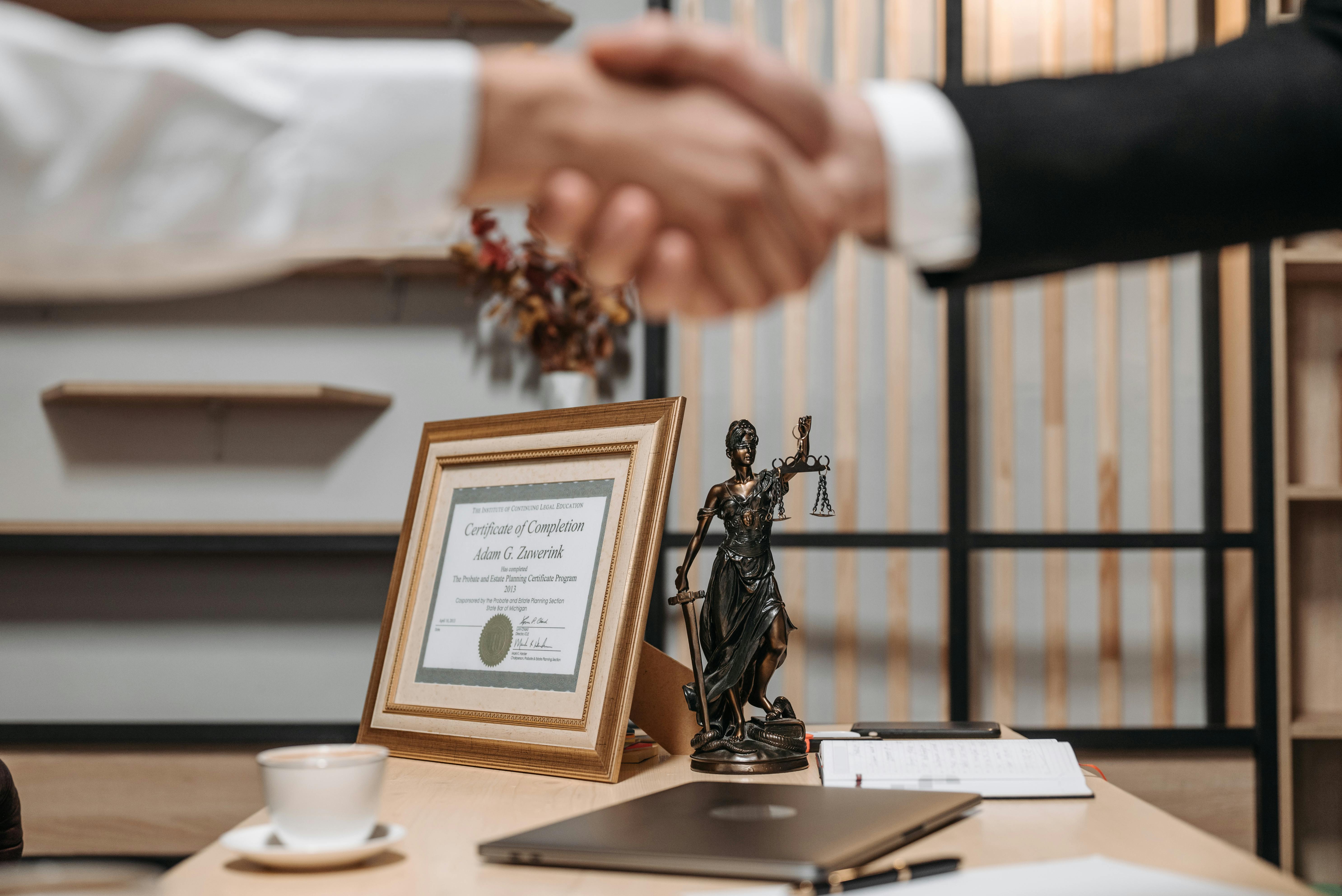 Lawyer Shaking Hands With Client